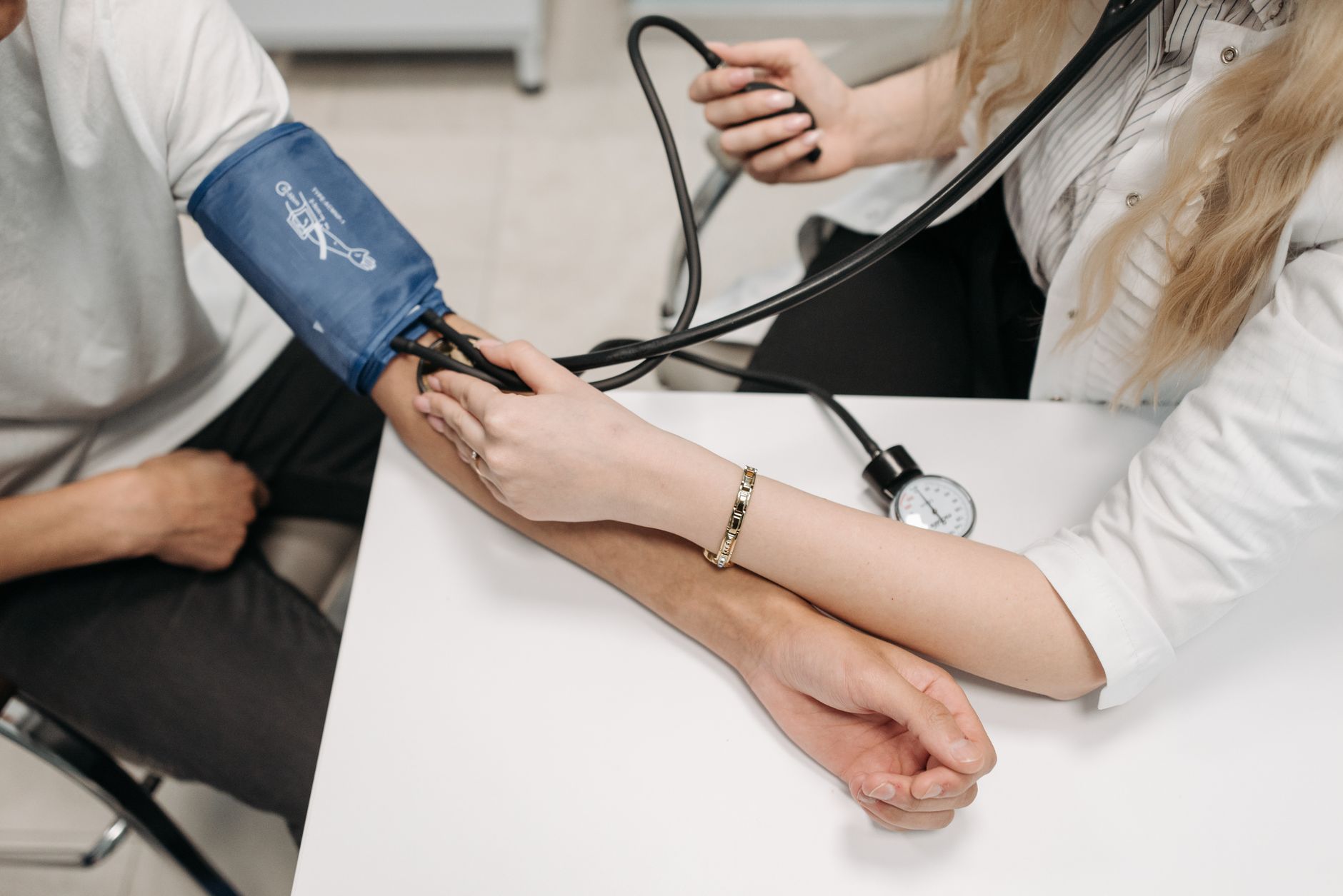 A blood pressure cuff being used at home